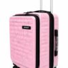 Salmon pink cabin luggage with black zippers and 360-degree spinner wheels.