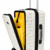 White hard shell laptop trolley bag with a geometric pattern and an open front compartment revealing a vibrant yellow interior.
